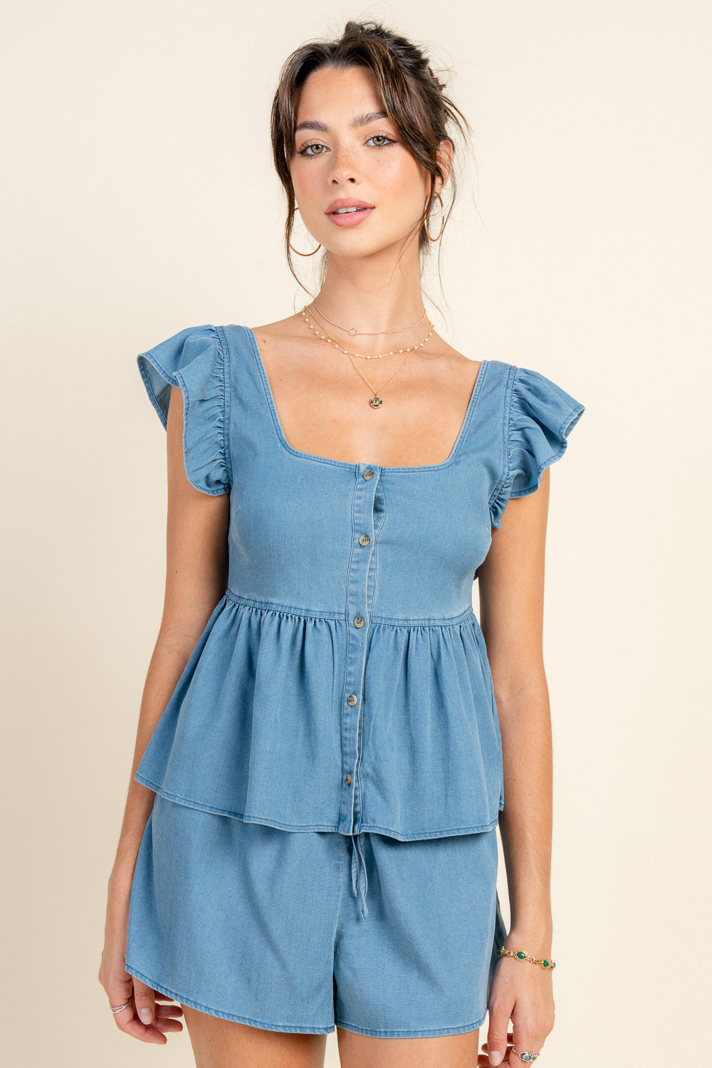 PEPLUM BUTTON DOWN TOP W/ RUFFLE SHOULDER, ELASTIC WAIST SHORTS W/ TIE FRONT